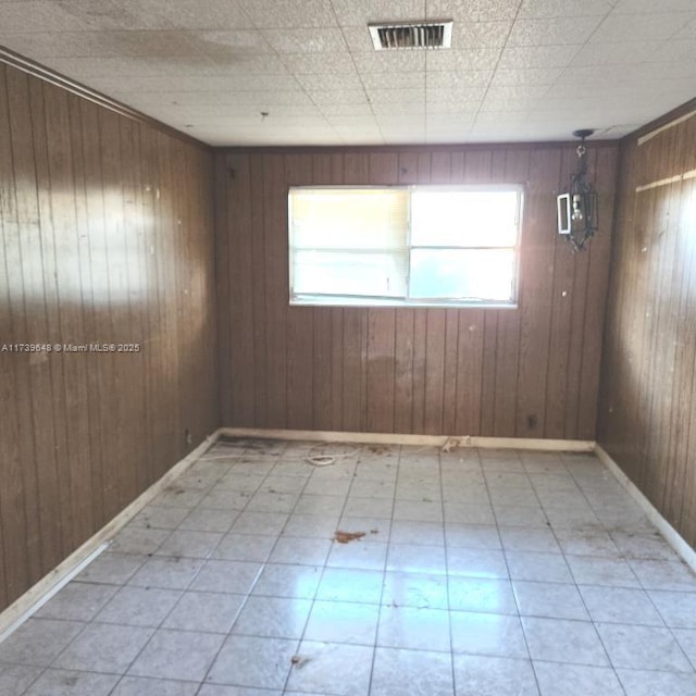 empty room with wooden walls