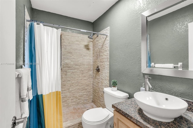 bathroom featuring vanity, a shower with curtain, and toilet