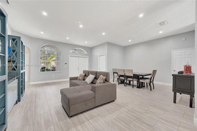 living room with a textured ceiling