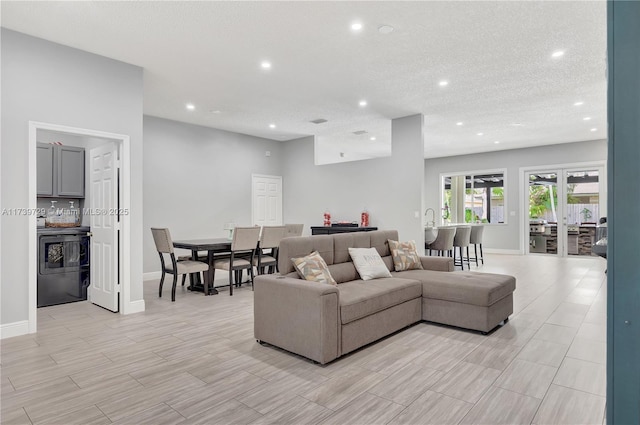 living room with a textured ceiling