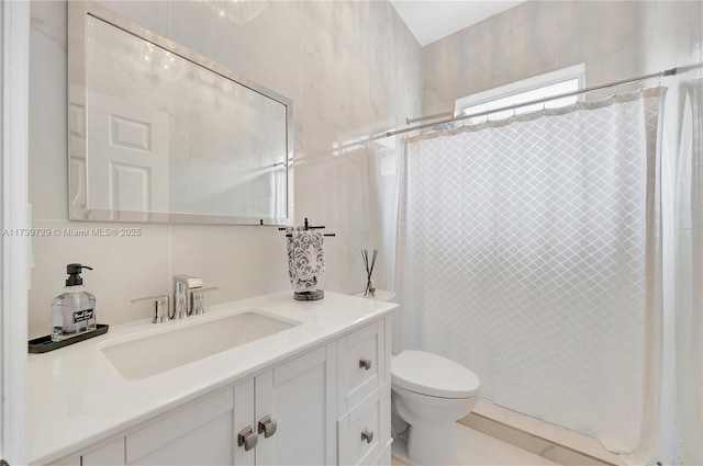 bathroom featuring vanity, toilet, and a shower with curtain