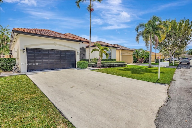 mediterranean / spanish-style house with a garage and a front lawn