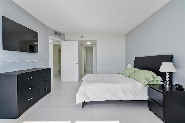 bedroom featuring light tile patterned floors