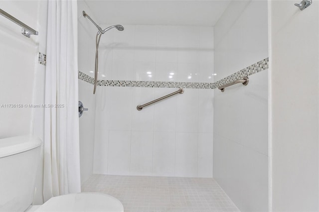 bathroom with a shower with curtain and toilet