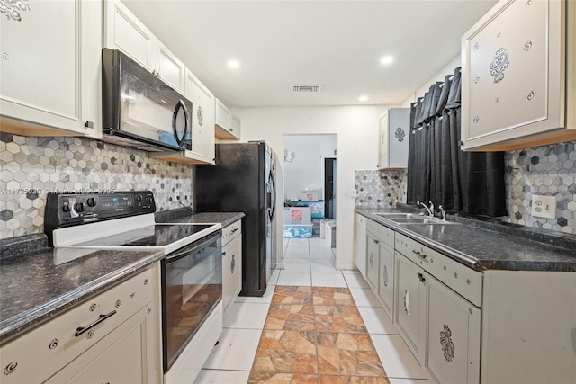 kitchen featuring backsplash, white cabinets, sink, and black appliances