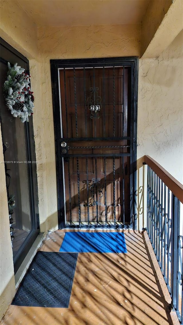 doorway to property featuring a balcony