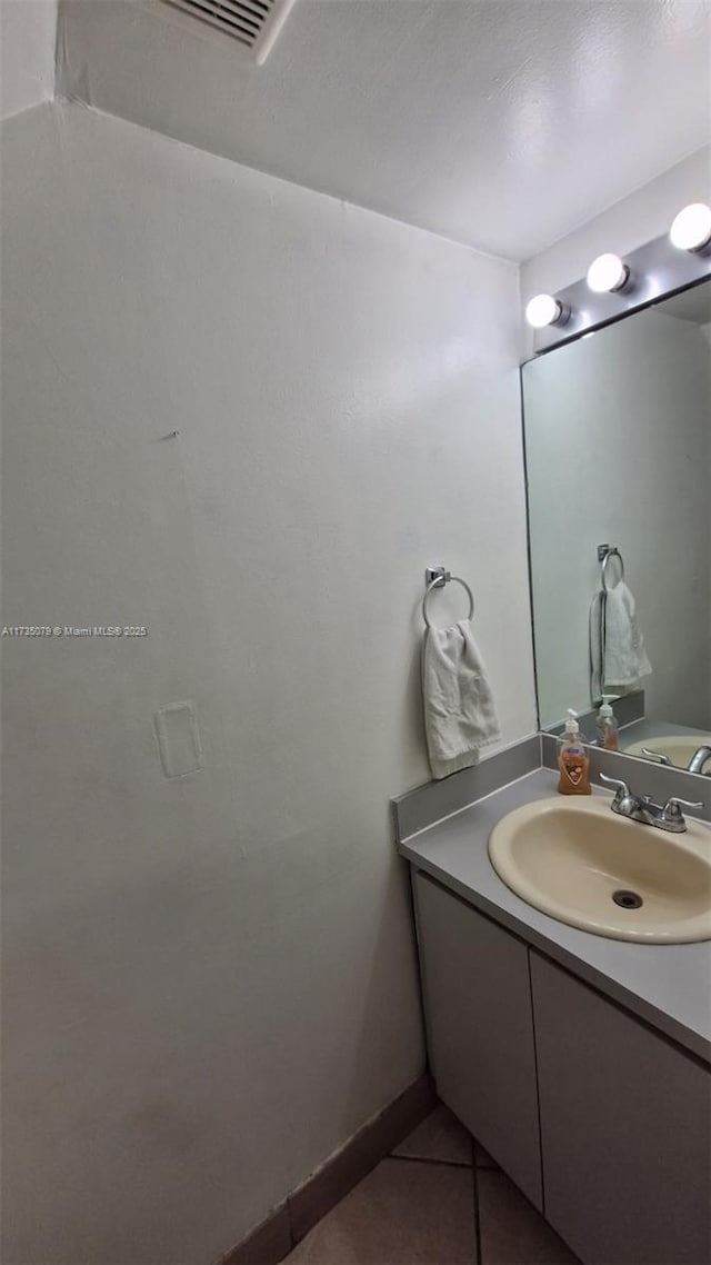 bathroom with vanity and tile patterned floors