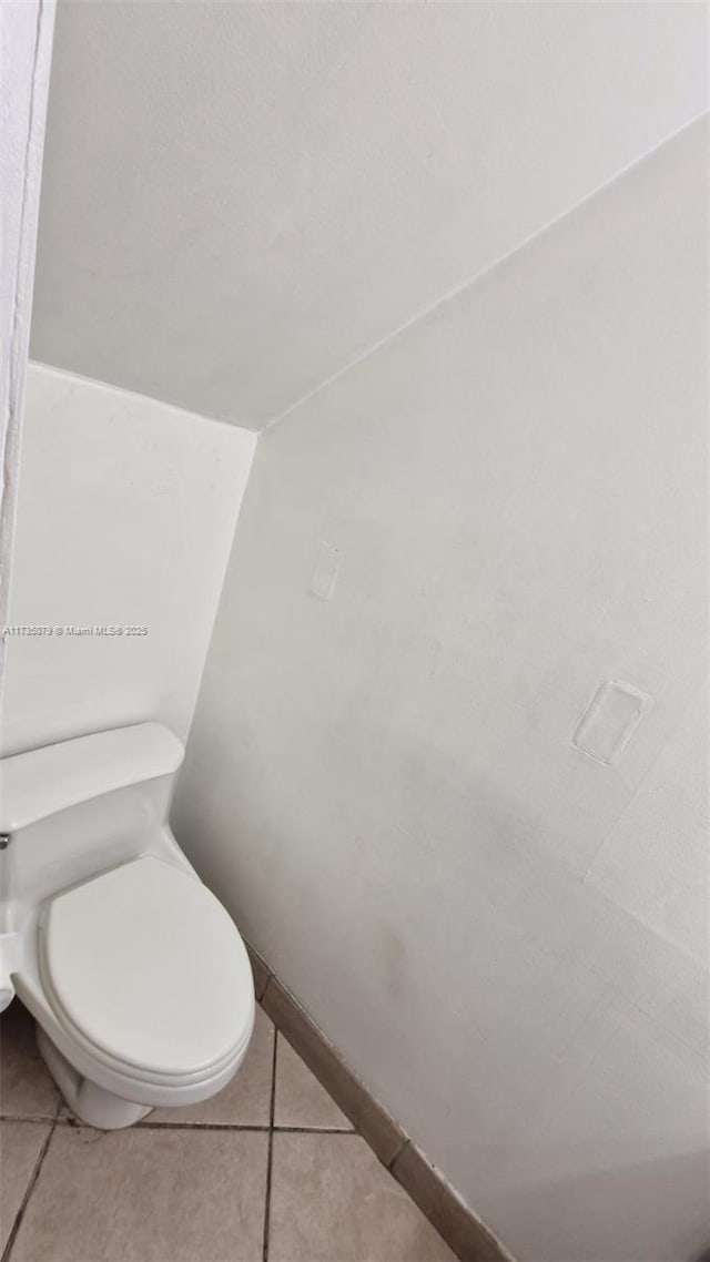 bathroom featuring tile patterned floors and toilet