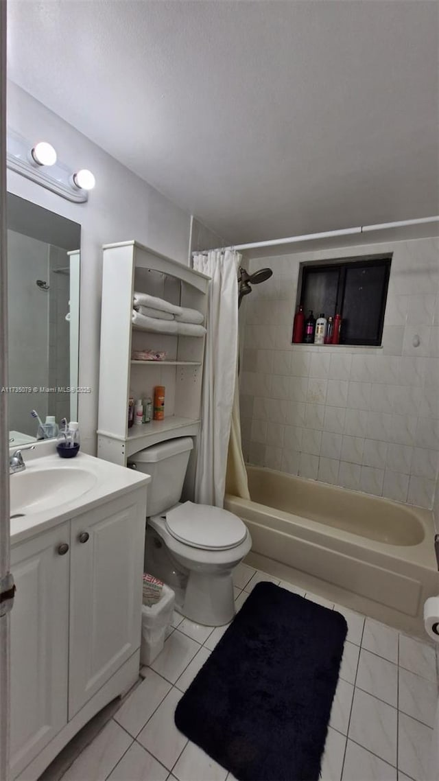 full bathroom with tile patterned flooring, vanity, shower / tub combo, and toilet