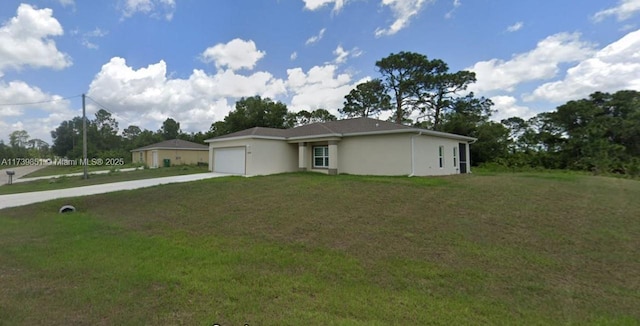 ranch-style home featuring a garage, driveway, and a front lawn