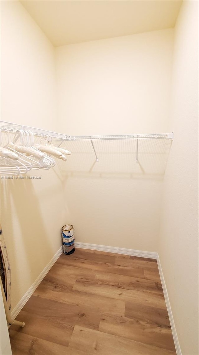 walk in closet featuring light wood-style floors