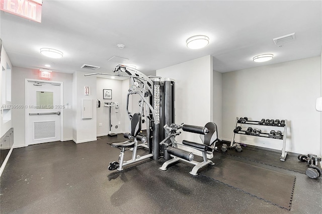 gym featuring baseboards and visible vents