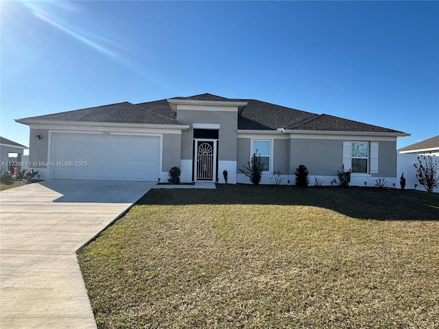 view of front facade featuring a garage and a front yard