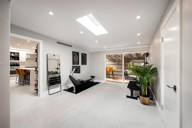 workout room with a skylight