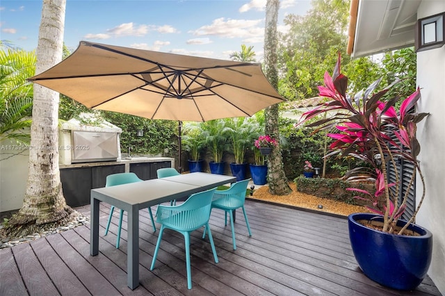 wooden deck with an outdoor bar