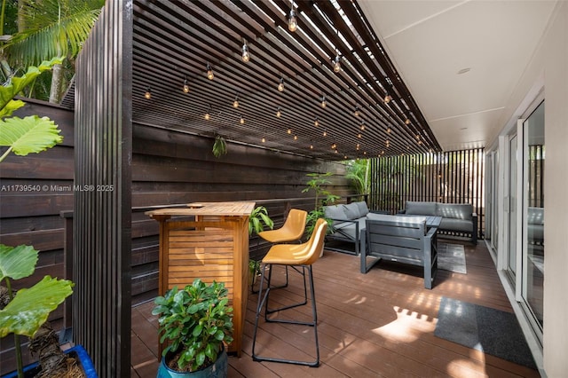 wooden deck featuring outdoor lounge area