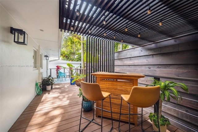 wooden deck featuring a pergola