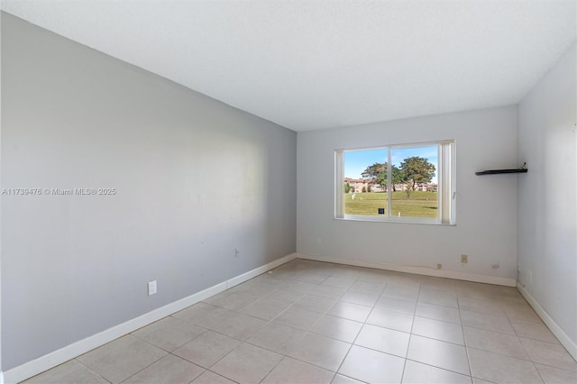 spare room with light tile patterned floors