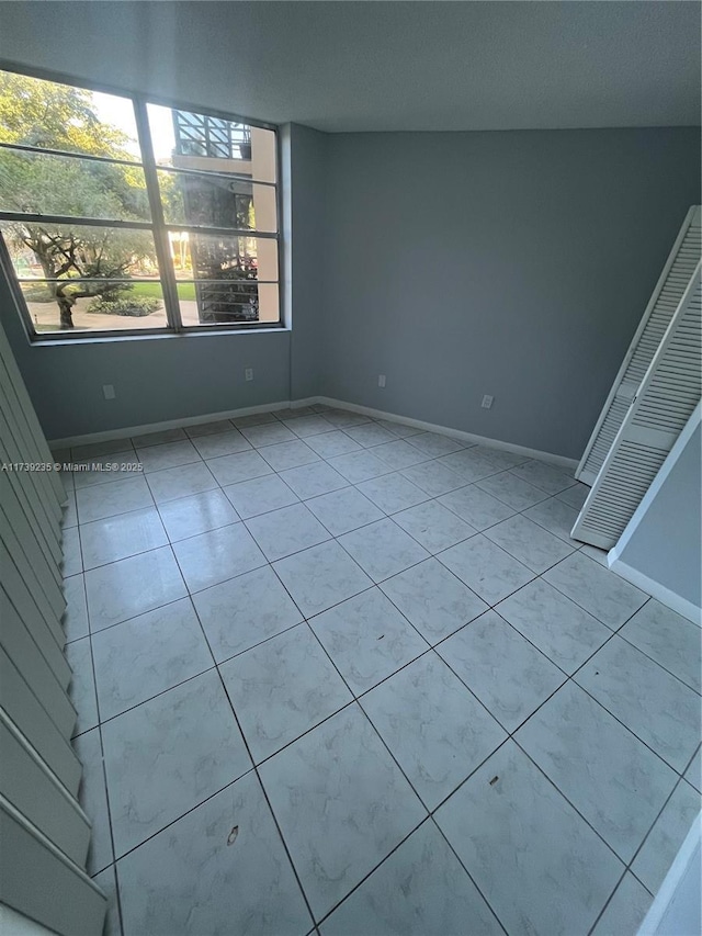 view of tiled spare room