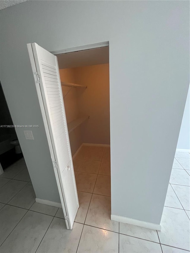 interior space with light tile patterned floors