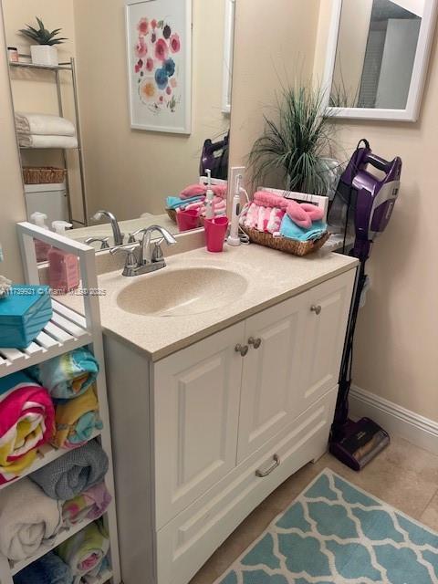 bathroom with vanity and tile patterned flooring