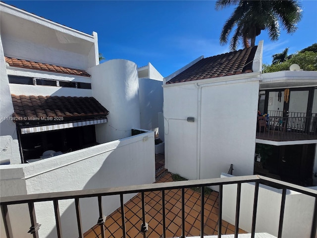 view of side of property featuring a balcony