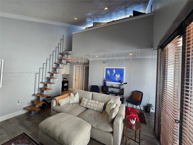 living room with hardwood / wood-style flooring and crown molding