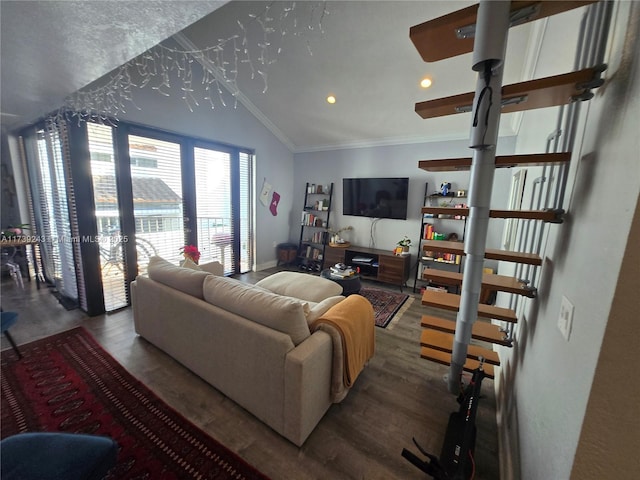 living room featuring vaulted ceiling, wood-type flooring, ornamental molding, and french doors