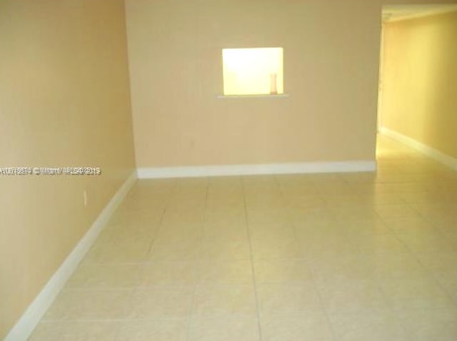 view of tiled spare room