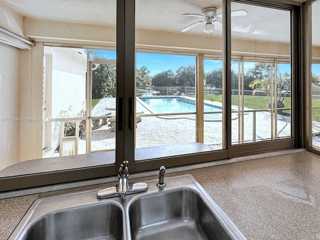 interior details with ceiling fan and sink