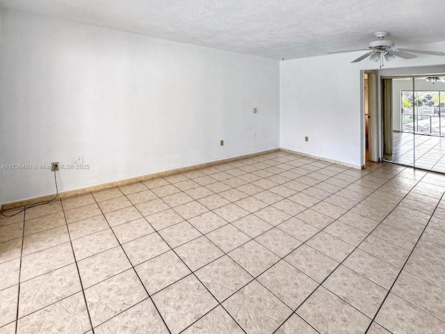 tiled spare room with ceiling fan and a textured ceiling