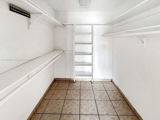 walk in closet featuring light tile patterned floors