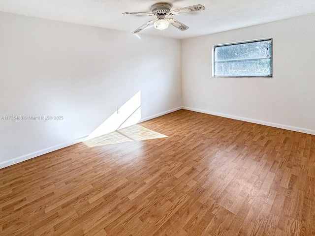 unfurnished room featuring hardwood / wood-style floors and ceiling fan