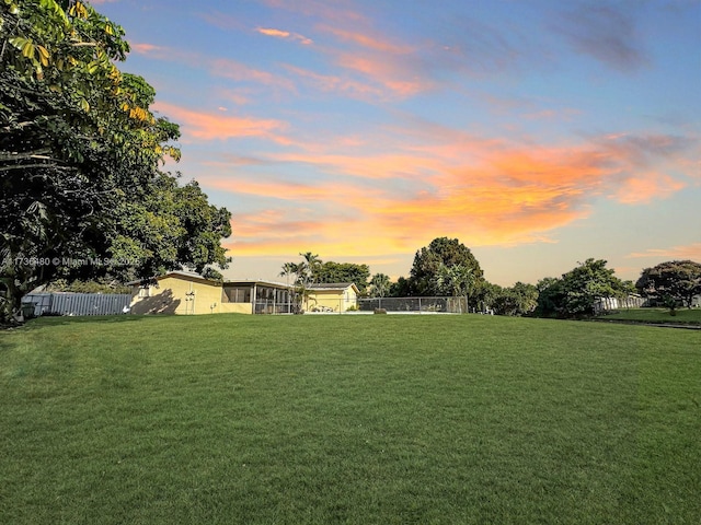 view of yard at dusk