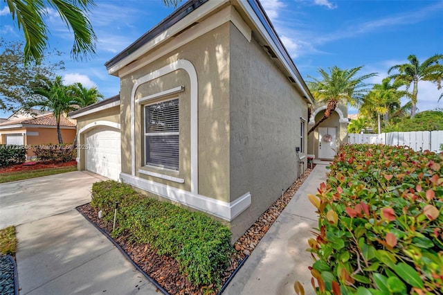 view of side of home with a garage