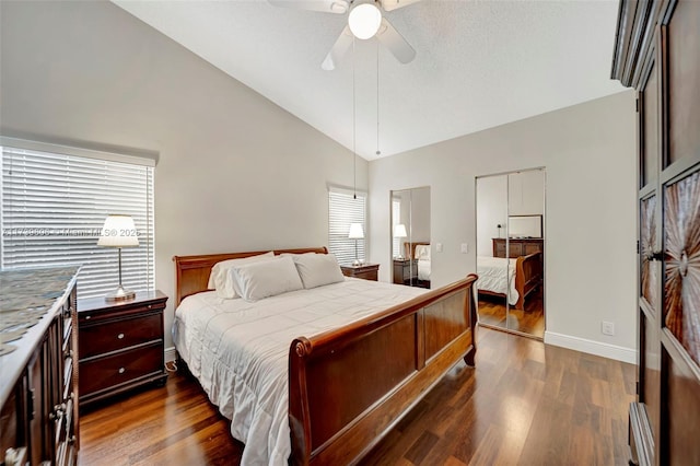 bedroom featuring lofted ceiling, dark hardwood / wood-style floors, and ceiling fan