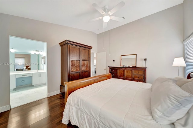 bedroom featuring ensuite bathroom, lofted ceiling, dark wood-type flooring, and ceiling fan