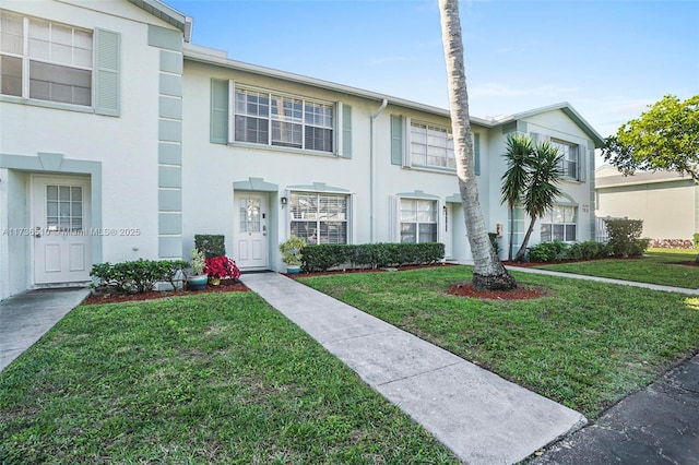 view of property featuring a front yard