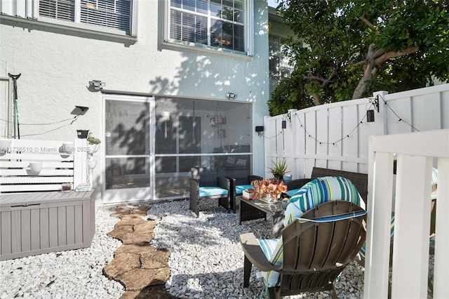 view of patio / terrace featuring an outdoor living space and a sunroom