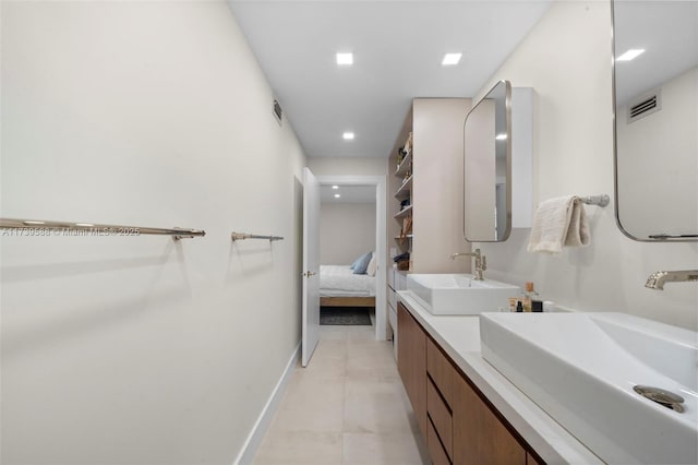 bathroom featuring vanity and tile patterned flooring