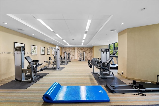 workout area featuring light colored carpet