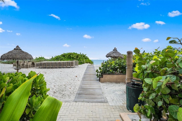 view of home's community with a gazebo and a water view