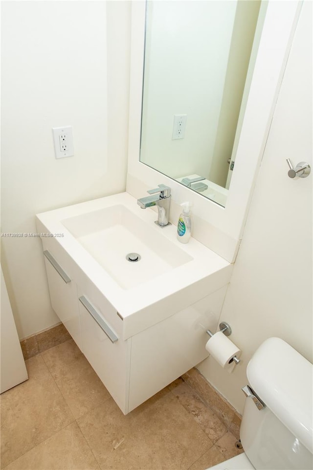 bathroom featuring vanity and toilet