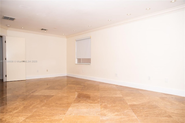 empty room featuring crown molding