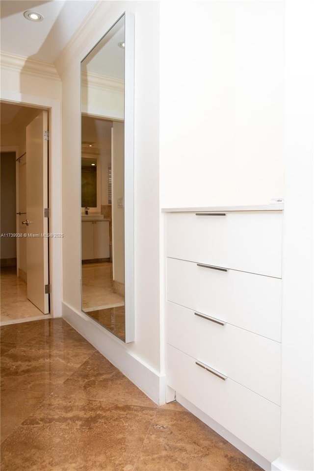 interior space with crown molding