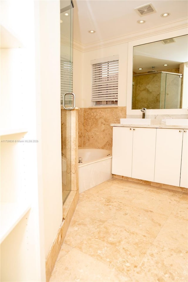 bathroom featuring vanity, crown molding, and plus walk in shower