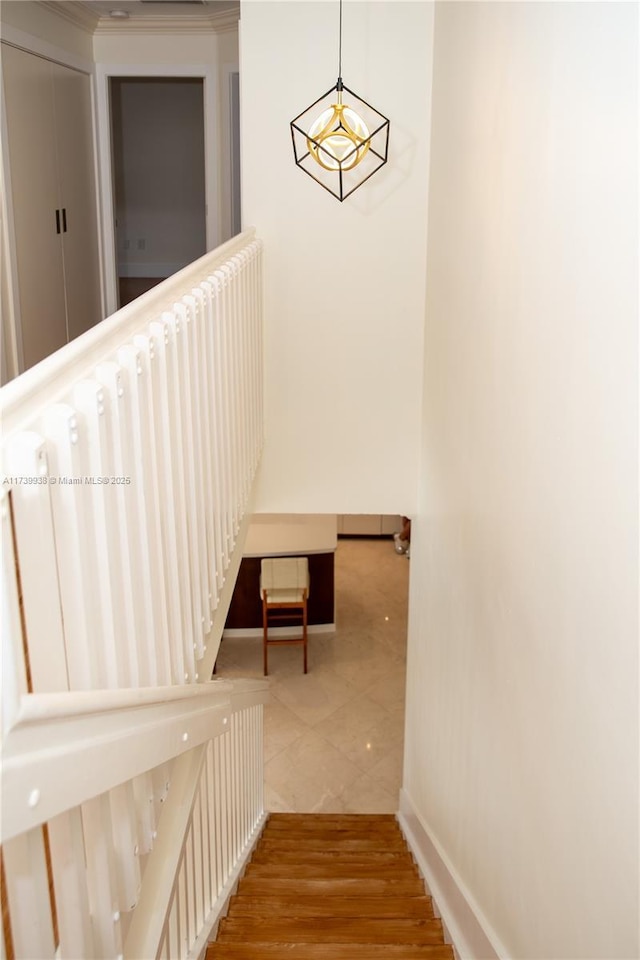 staircase with hardwood / wood-style flooring