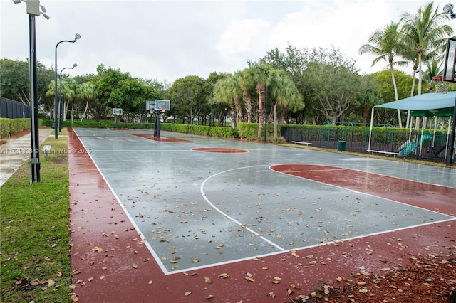 view of sport court featuring a playground