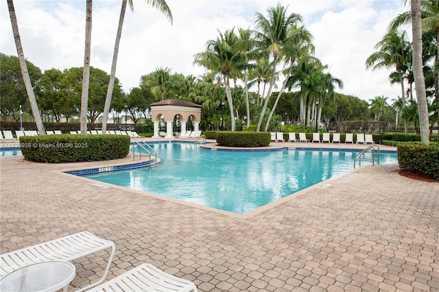 view of swimming pool featuring a patio area