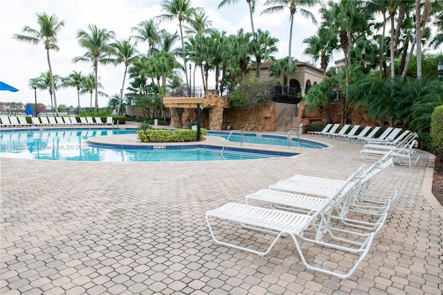 view of swimming pool with a patio